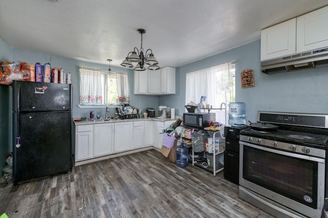 448 E Tuolumne St, Fresno, CA 93706 - kitchen with black appliances, a chandelier, white cabinets, wood finished floors, and healthy amount of natural light