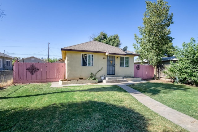 448 E Tuolumne St, Fresno, CA 93706 - bungalow featuring stucco siding, a shingled roof, and a gate