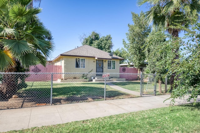 448 E Tuolumne St, Fresno, CA 93706 - bungalow-style house with stucco siding, a fenced front yard, a gate, and roof with shingles