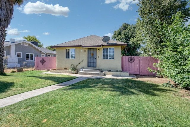 448 E Tuolumne St, Fresno, CA 93706 - bungalow-style house featuring stucco siding and a shingled roof