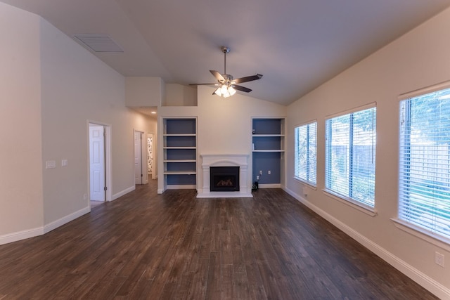 1963 Rialto Ct, Clovis, CA 93611 - unfurnished living room with a fireplace with raised hearth, dark wood-type flooring, built in shelves, ceiling fan, and high vaulted ceiling