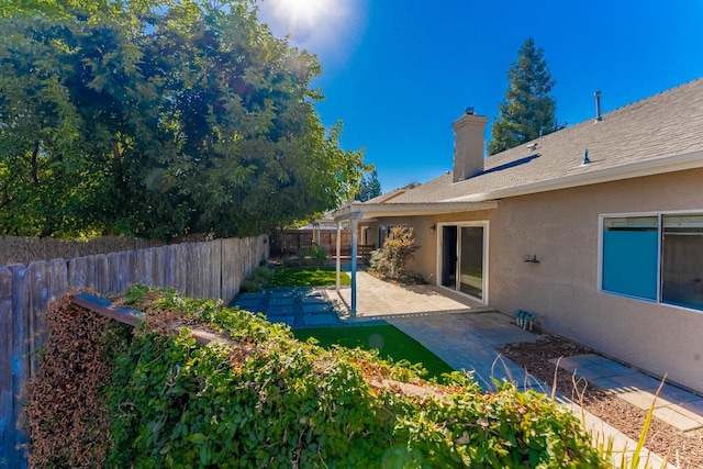 1963 Rialto Ct, Clovis, CA 93611 - fenced backyard with a patio