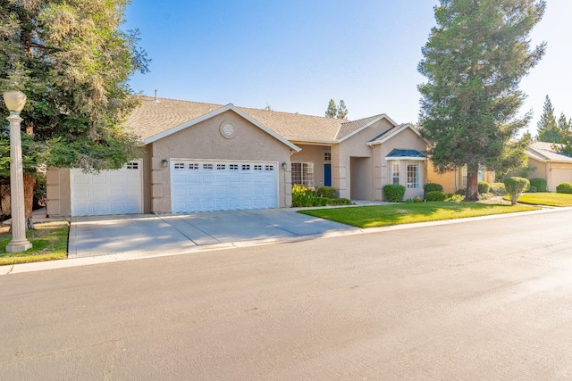 1963 Rialto Ct, Clovis, CA 93611 - ranch-style house featuring stucco siding, driveway, an attached garage, and a front yard
