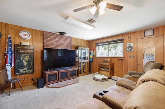 44810 Douglas Rd S, Coarsegold, CA 93614 - carpeted living room with wooden walls and ceiling fan