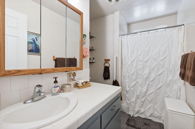 44810 Douglas Rd S, Coarsegold, CA 93614 - bathroom with vanity, backsplash, and curtained shower