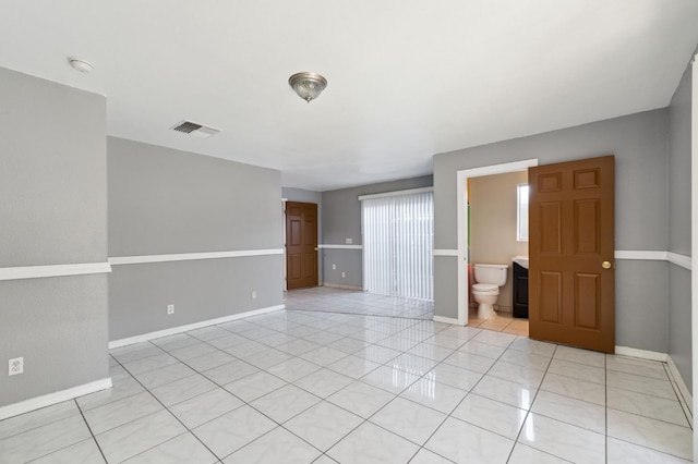 3924 E Iowa Ave, Fresno, CA 93702 - unfurnished room featuring light tile patterned floors and a smoke detector