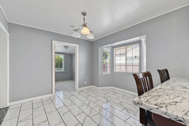 3924 E Iowa Ave, Fresno, CA 93702 - dining room featuring light marble finish flooring and ornamental molding