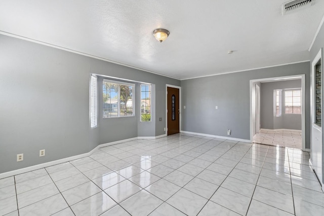 3924 E Iowa Ave, Fresno, CA 93702 - spare room with crown molding and light tile patterned flooring
