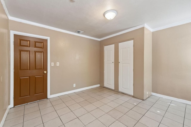 3924 E Iowa Ave, Fresno, CA 93702 - spare room with ornamental molding and light tile patterned floors