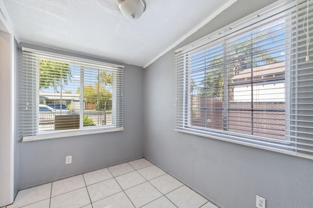 3924 E Iowa Ave, Fresno, CA 93702 - tiled empty room with a textured ceiling