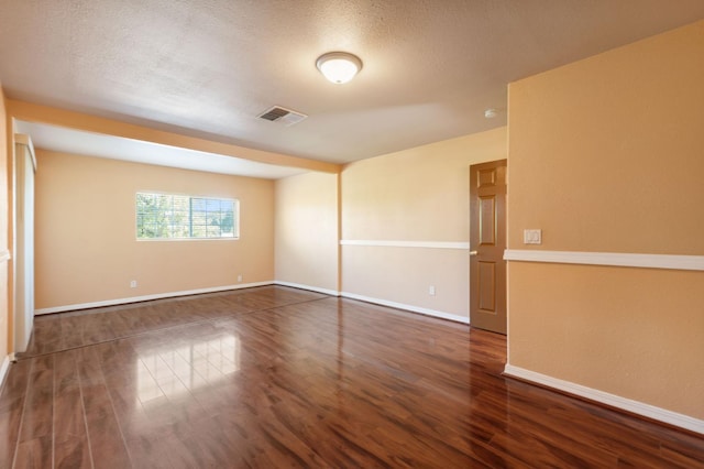 3924 E Iowa Ave, Fresno, CA 93702 - spare room featuring wood finished floors and a textured ceiling