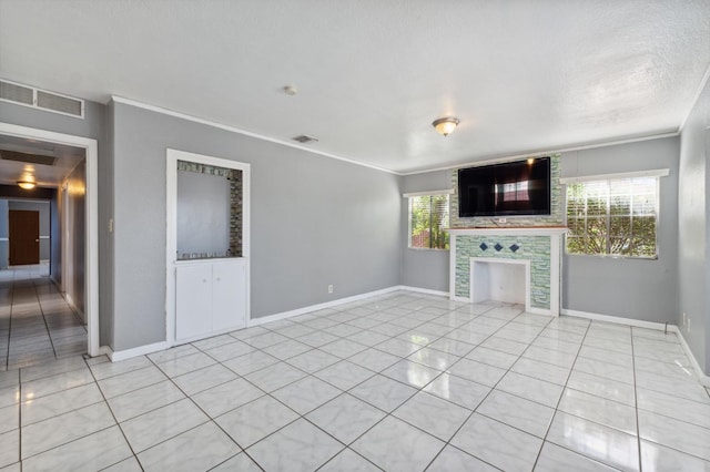 3924 E Iowa Ave, Fresno, CA 93702 - unfurnished living room with light tile patterned floors, ornamental molding, and a fireplace