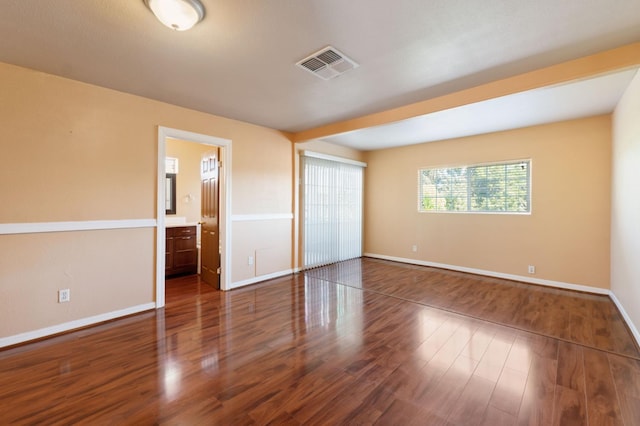 3924 E Iowa Ave, Fresno, CA 93702 - unfurnished bedroom featuring wood finished floors and ensuite bathroom
