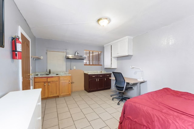 3924 E Iowa Ave, Fresno, CA 93702 - bedroom featuring light tile patterned floors and a desk