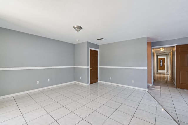 3924 E Iowa Ave, Fresno, CA 93702 - spare room with light tile patterned floors and baseboards