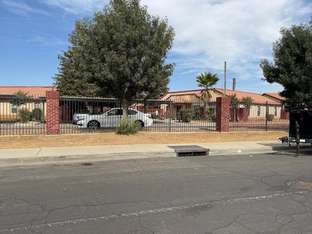 1405 E Cypress Ave Unit 157, Reedley, CA 93654 - view of front of house featuring a fenced front yard