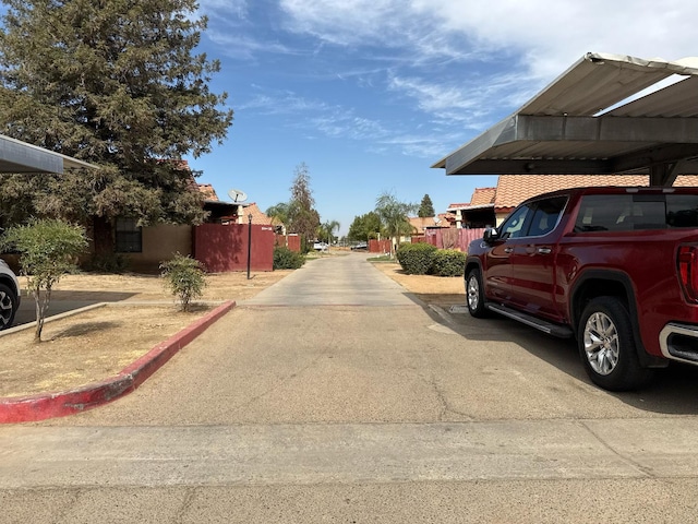 1405 E Cypress Ave Unit 157, Reedley, CA 93654 - view of asphalt road with a residential view