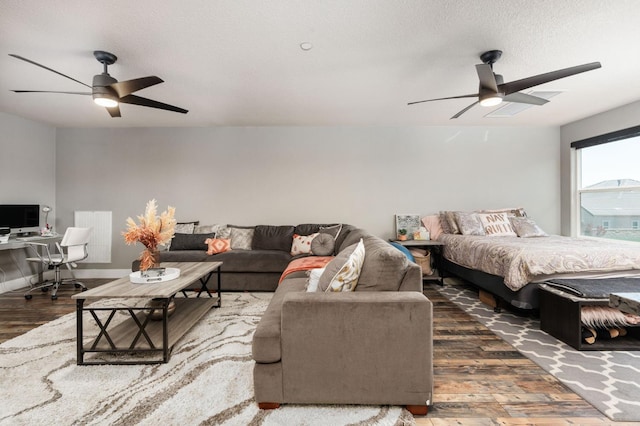 1397 N Redington Ave, Clovis, CA 93619 - bedroom with wood finished floors, a desk, ceiling fan, and a textured ceiling