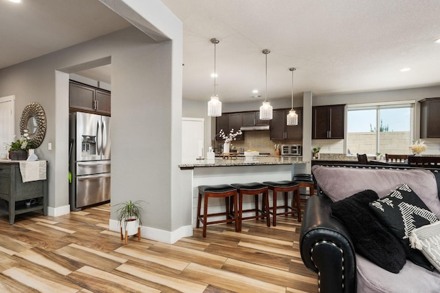 1397 N Redington Ave, Clovis, CA 93619 - living room with recessed lighting and light wood-style floors