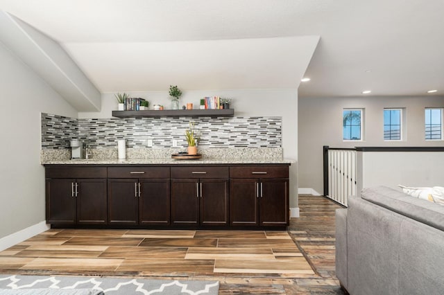 1397 N Redington Ave, Clovis, CA 93619 - indoor wet bar featuring backsplash, light wood-style flooring, and recessed lighting