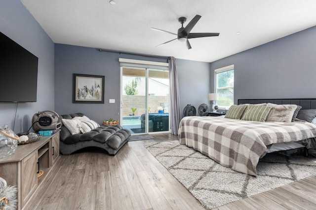 1397 N Redington Ave, Clovis, CA 93619 - bedroom featuring access to exterior, wood finished floors, and a ceiling fan