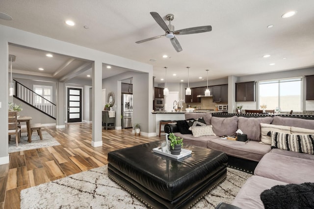 1397 N Redington Ave, Clovis, CA 93619 - living area featuring recessed lighting, ceiling fan, light wood-style flooring, and stairs