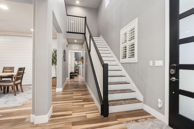 1397 N Redington Ave, Clovis, CA 93619 - foyer entrance featuring wood finished floors, stairs, a towering ceiling, and recessed lighting