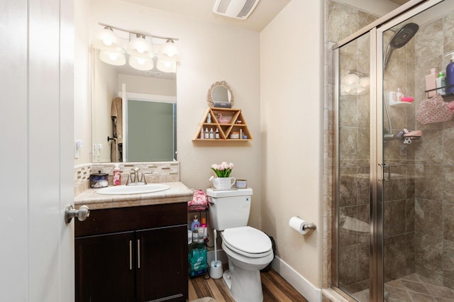 1397 N Redington Ave, Clovis, CA 93619 - full bath featuring vanity, a stall shower, wood finished floors, and backsplash