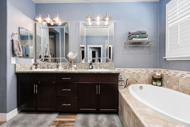 1397 N Redington Ave, Clovis, CA 93619 - full bathroom featuring double vanity, a bath, and wood finished floors