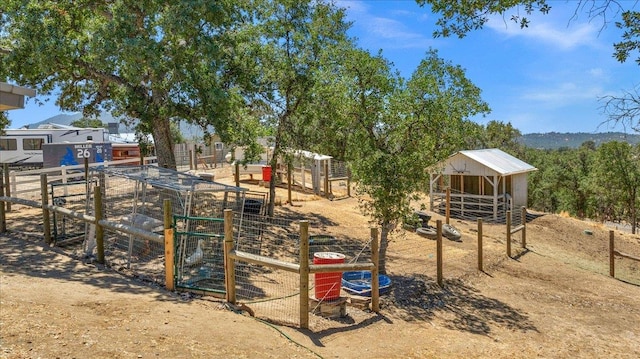 34503 Backbone Rd, Auberry, CA 93602 - view of play area with an outdoor structure and an exterior structure