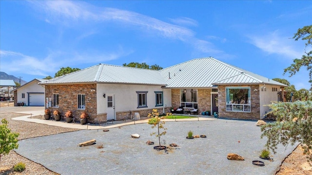 34503 Backbone Rd, Auberry, CA 93602 - view of front facade with stone siding, a metal roof, and stucco siding