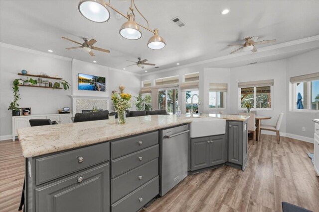 34503 Backbone Rd, Auberry, CA 93602 - kitchen featuring stainless steel dishwasher, gray cabinetry, a ceiling fan, open floor plan, and light wood-style flooring