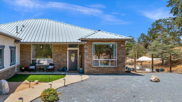 34503 Backbone Rd, Auberry, CA 93602 - view of front facade with stone siding and a metal roof