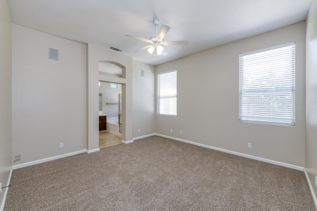 5484 W El Paso Ave, Fresno, CA 93722 - unfurnished bedroom featuring carpet flooring, connected bathroom, and ceiling fan