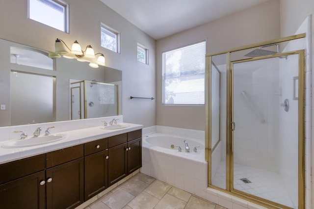 5484 W El Paso Ave, Fresno, CA 93722 - bathroom with a stall shower, double vanity, a whirlpool tub, and tile patterned flooring