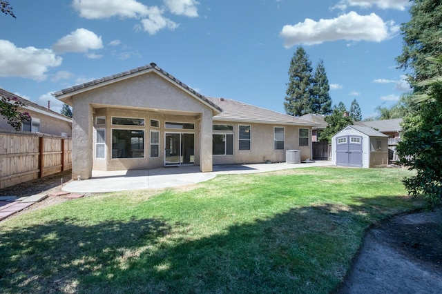 5484 W El Paso Ave, Fresno, CA 93722 - rear view of house featuring stucco siding, a shed, a patio area, and a tiled roof