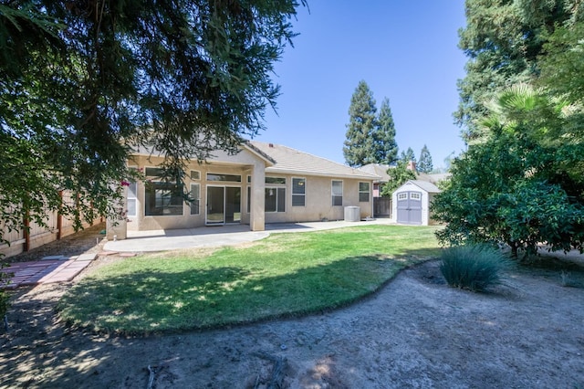5484 W El Paso Ave, Fresno, CA 93722 - rear view of house featuring a storage shed, stucco siding, a patio, and a tile roof