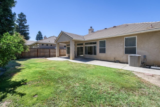 5484 W El Paso Ave, Fresno, CA 93722 - back of house featuring a chimney, a patio area, stucco siding, and a tiled roof