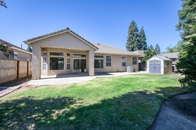 5484 W El Paso Ave, Fresno, CA 93722 - rear view of property with a storage shed, stucco siding, a patio area, and a tiled roof