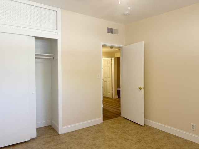 2723 E Lansing Way, Fresno, CA 93726 - unfurnished bedroom featuring a closet and baseboards