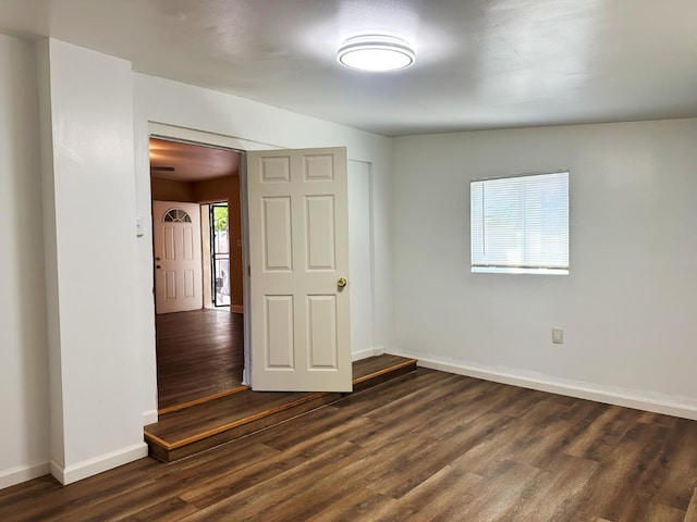 2723 E Lansing Way, Fresno, CA 93726 - spare room with dark wood-style floors and baseboards