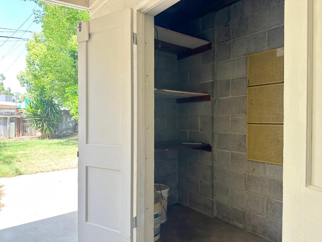 2723 E Lansing Way, Fresno, CA 93726 - bathroom with concrete floors and concrete block wall