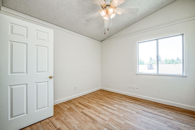 6355 N Cleo Ave, Fresno, CA 93722 - unfurnished room with lofted ceiling, light wood-style flooring, a ceiling fan, and a textured ceiling