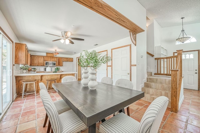 6355 N Cleo Ave, Fresno, CA 93722 - dining room featuring stairway and a ceiling fan