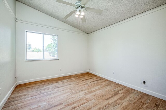 6355 N Cleo Ave, Fresno, CA 93722 - spare room with vaulted ceiling, light wood-style floors, a textured ceiling, and a ceiling fan