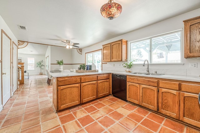 6355 N Cleo Ave, Fresno, CA 93722 - kitchen featuring black dishwasher, a peninsula, brown cabinets, and healthy amount of natural light