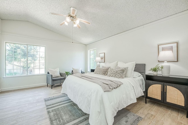 6355 N Cleo Ave, Fresno, CA 93722 - bedroom featuring a textured ceiling, wood finished floors, vaulted ceiling, and ceiling fan