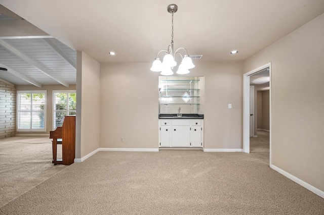 1702 W Bullard Unit 105, Fresno, CA 93711 - unfurnished dining area with light carpet, beamed ceiling, a chandelier, and recessed lighting