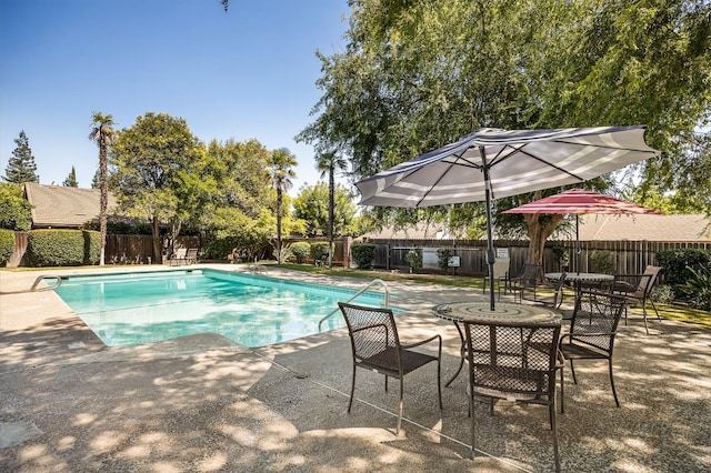 1702 W Bullard Unit 105, Fresno, CA 93711 - view of swimming pool featuring a patio and a fenced backyard