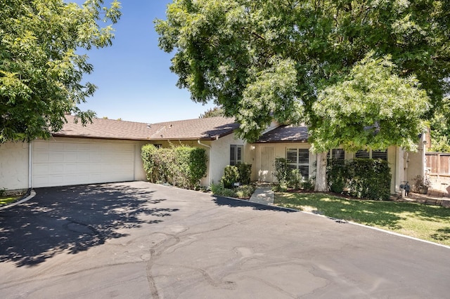 1702 W Bullard Unit 105, Fresno, CA 93711 - single story home featuring concrete driveway, an attached garage, and stucco siding